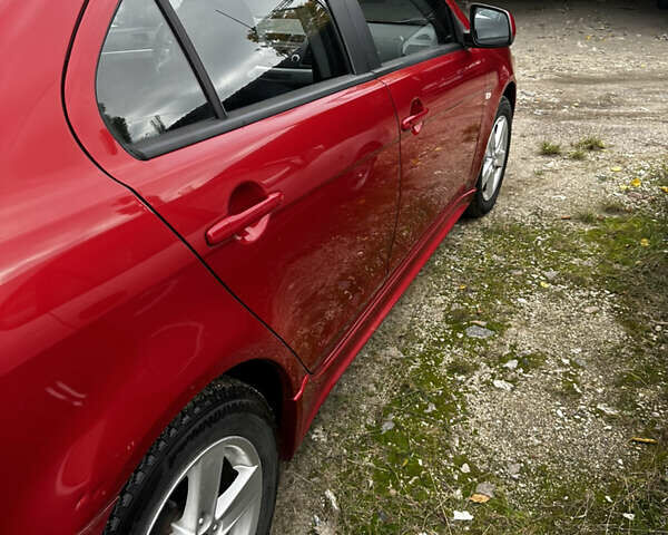 Красный Мицубиси Лансер, объемом двигателя 2 л и пробегом 92 тыс. км за 6500 $, фото 10 на Automoto.ua