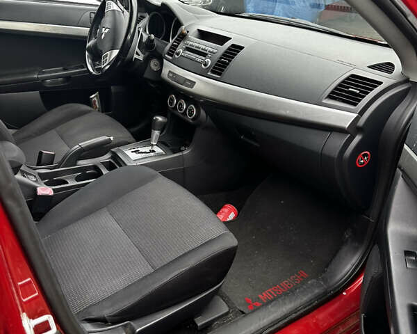 Красный Мицубиси Лансер, объемом двигателя 2 л и пробегом 92 тыс. км за 6500 $, фото 12 на Automoto.ua