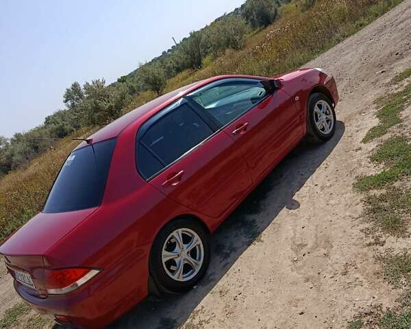 Червоний Міцубісі Lancer, об'ємом двигуна 1.6 л та пробігом 246 тис. км за 5500 $, фото 12 на Automoto.ua