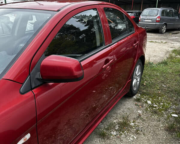 Красный Мицубиси Лансер, объемом двигателя 2 л и пробегом 92 тыс. км за 6500 $, фото 9 на Automoto.ua