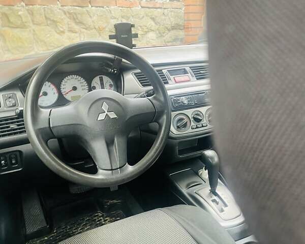 Червоний Міцубісі Lancer, об'ємом двигуна 1.58 л та пробігом 132 тис. км за 5300 $, фото 11 на Automoto.ua