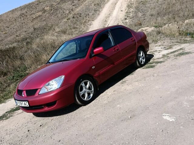 Червоний Міцубісі Lancer, об'ємом двигуна 1.6 л та пробігом 246 тис. км за 5000 $, фото 5 на Automoto.ua