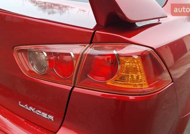 Красный Мицубиси Лансер, объемом двигателя 2 л и пробегом 120 тыс. км за 7800 $, фото 13 на Automoto.ua
