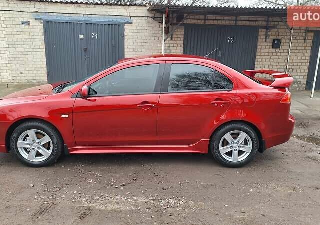 Красный Мицубиси Лансер, объемом двигателя 2 л и пробегом 120 тыс. км за 7800 $, фото 1 на Automoto.ua
