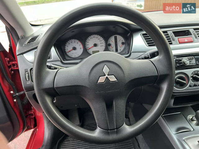 Міцубісі Lancer 2009 у Вінниці на Automoto.ua Червоний Міцубісі Lancer, об'ємом двигуна 1.58 л та пробігом 133 тис. км за 6750 $, фото 35 на Automoto.ua