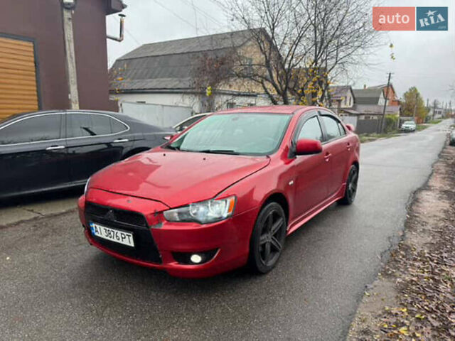 Красный Мицубиси Лансер, объемом двигателя 2 л и пробегом 246 тыс. км за 4900 $, фото 1 на Automoto.ua