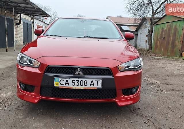 Красный Мицубиси Лансер, объемом двигателя 2 л и пробегом 120 тыс. км за 7800 $, фото 7 на Automoto.ua