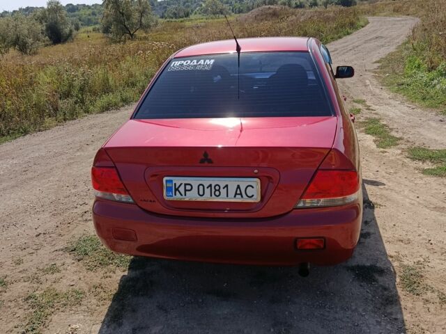 Червоний Міцубісі Lancer, об'ємом двигуна 1.6 л та пробігом 246 тис. км за 5000 $, фото 13 на Automoto.ua