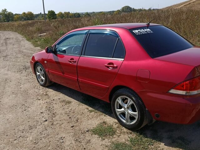 Червоний Міцубісі Lancer, об'ємом двигуна 1.6 л та пробігом 246 тис. км за 5000 $, фото 12 на Automoto.ua