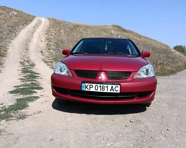 Червоний Міцубісі Lancer, об'ємом двигуна 1.6 л та пробігом 246 тис. км за 5500 $, фото 1 на Automoto.ua