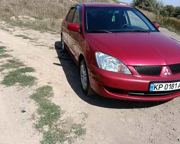 Червоний Міцубісі Lancer, об'ємом двигуна 1.6 л та пробігом 246 тис. км за 5500 $, фото 9 на Automoto.ua