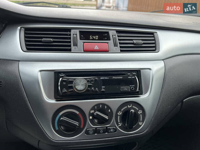 Міцубісі Lancer 2009 у Вінниці на Automoto.ua Червоний Міцубісі Lancer, об'ємом двигуна 1.58 л та пробігом 133 тис. км за 6750 $, фото 41 на Automoto.ua