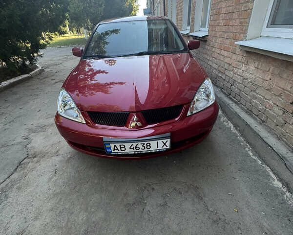 Красный Мицубиси Лансер, объемом двигателя 1.6 л и пробегом 140 тыс. км за 6000 $, фото 6 на Automoto.ua