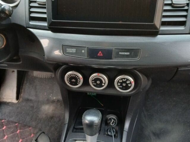 Червоний Міцубісі Lancer, об'ємом двигуна 2 л та пробігом 2 тис. км за 6200 $, фото 13 на Automoto.ua