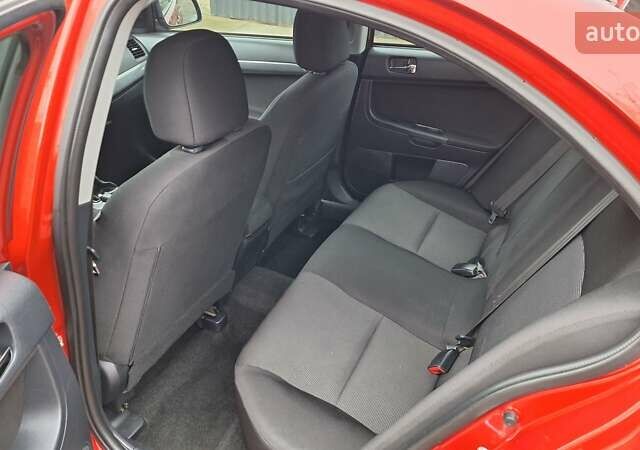 Красный Мицубиси Лансер, объемом двигателя 2 л и пробегом 120 тыс. км за 7800 $, фото 28 на Automoto.ua