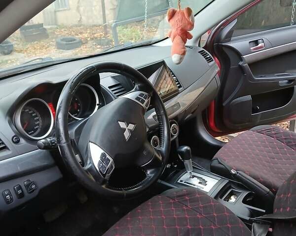 Червоний Міцубісі Lancer, об'ємом двигуна 2 л та пробігом 228 тис. км за 6200 $, фото 13 на Automoto.ua