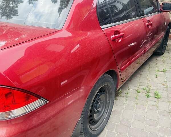 Червоний Міцубісі Lancer, об'ємом двигуна 1.58 л та пробігом 132 тис. км за 5300 $, фото 27 на Automoto.ua