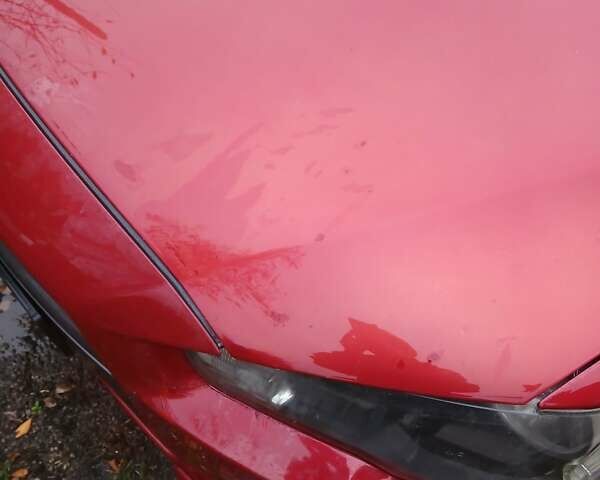 Червоний Міцубісі Lancer, об'ємом двигуна 2 л та пробігом 228 тис. км за 6200 $, фото 1 на Automoto.ua