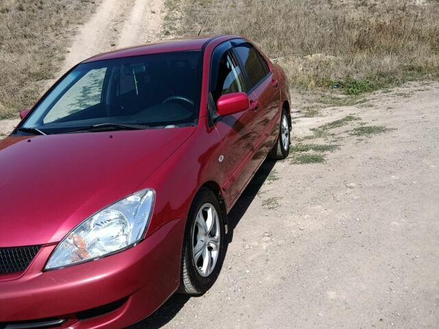 Червоний Міцубісі Lancer, об'ємом двигуна 1.6 л та пробігом 246 тис. км за 5000 $, фото 2 на Automoto.ua