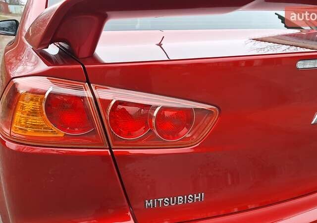 Красный Мицубиси Лансер, объемом двигателя 2 л и пробегом 120 тыс. км за 7800 $, фото 12 на Automoto.ua