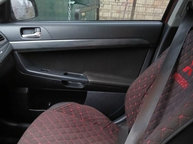 Червоний Міцубісі Lancer, об'ємом двигуна 2 л та пробігом 2 тис. км за 6200 $, фото 8 на Automoto.ua