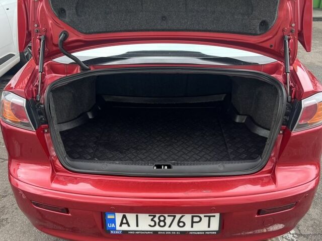 Червоний Міцубісі Lancer, об'ємом двигуна 2 л та пробігом 240 тис. км за 4900 $, фото 4 на Automoto.ua