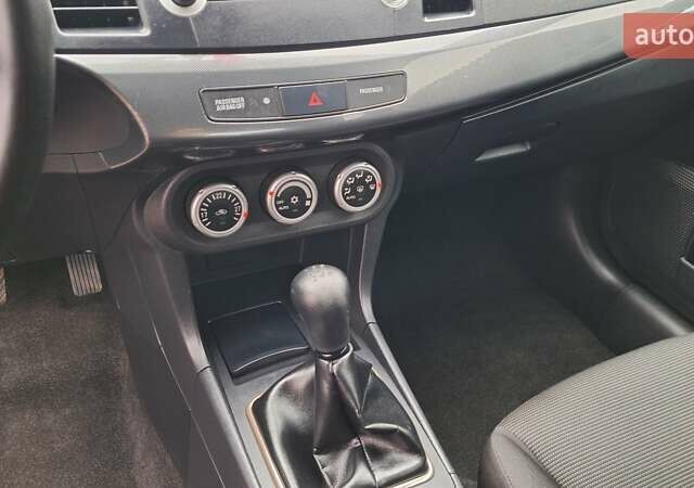 Красный Мицубиси Лансер, объемом двигателя 2 л и пробегом 120 тыс. км за 7800 $, фото 26 на Automoto.ua