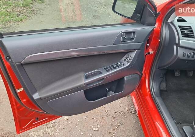 Красный Мицубиси Лансер, объемом двигателя 2 л и пробегом 120 тыс. км за 7800 $, фото 24 на Automoto.ua