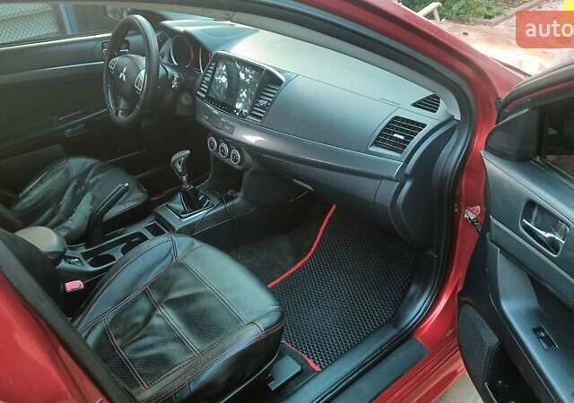 Червоний Міцубісі Lancer, об'ємом двигуна 2 л та пробігом 173 тис. км за 6900 $, фото 5 на Automoto.ua