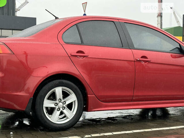 Червоний Міцубісі Lancer, об'ємом двигуна 2 л та пробігом 121 тис. км за 8700 $, фото 1 на Automoto.ua