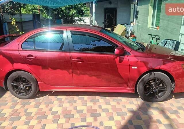 Червоний Міцубісі Lancer, об'ємом двигуна 2 л та пробігом 173 тис. км за 6900 $, фото 14 на Automoto.ua