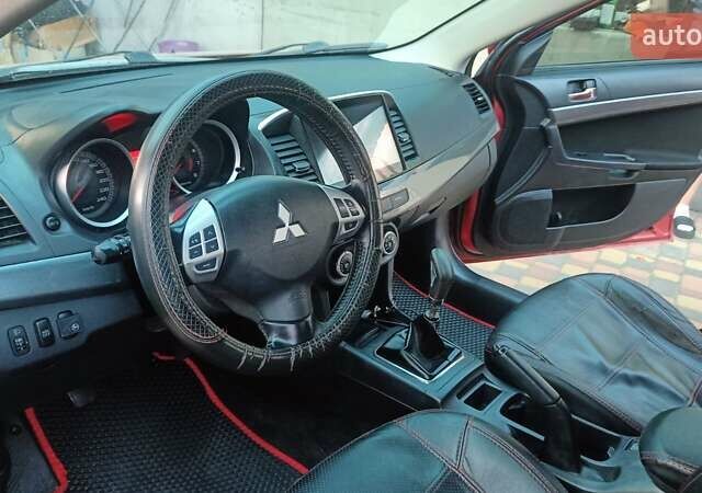 Червоний Міцубісі Lancer, об'ємом двигуна 2 л та пробігом 173 тис. км за 6900 $, фото 4 на Automoto.ua