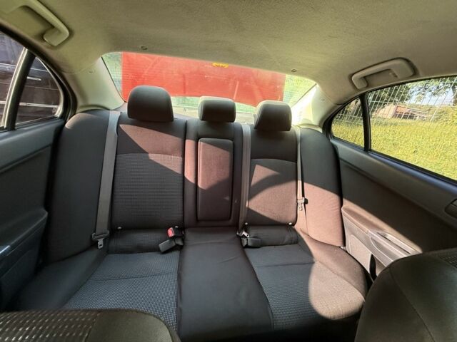 Красный Мицубиси Лансер, объемом двигателя 2 л и пробегом 215 тыс. км за 5999 $, фото 9 на Automoto.ua