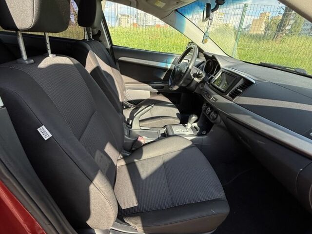 Красный Мицубиси Лансер, объемом двигателя 2 л и пробегом 215 тыс. км за 5999 $, фото 10 на Automoto.ua