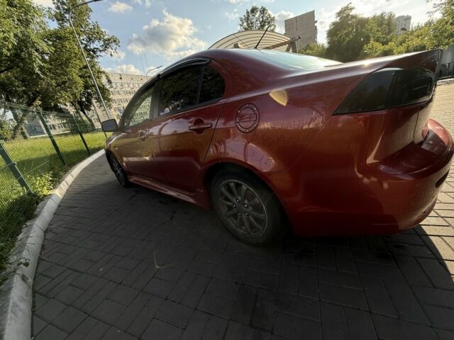 Красный Мицубиси Лансер, объемом двигателя 2 л и пробегом 215 тыс. км за 5999 $, фото 4 на Automoto.ua