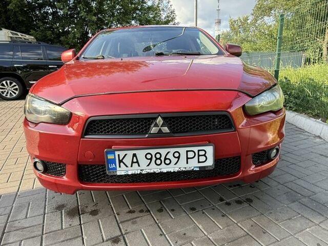 Красный Мицубиси Лансер, объемом двигателя 2 л и пробегом 215 тыс. км за 5999 $, фото 6 на Automoto.ua