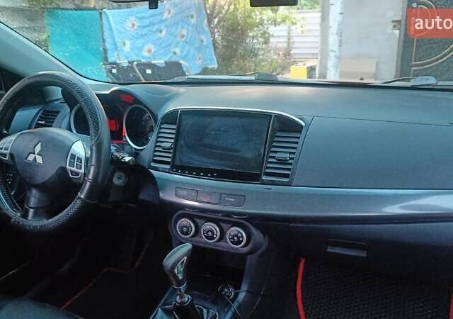 Червоний Міцубісі Lancer, об'ємом двигуна 2 л та пробігом 173 тис. км за 6900 $, фото 6 на Automoto.ua