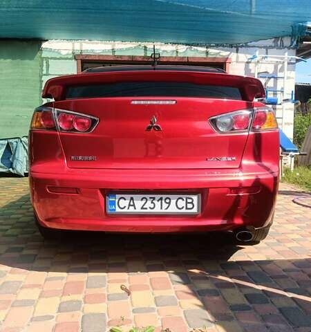 Червоний Міцубісі Lancer, об'ємом двигуна 2 л та пробігом 173 тис. км за 6900 $, фото 13 на Automoto.ua