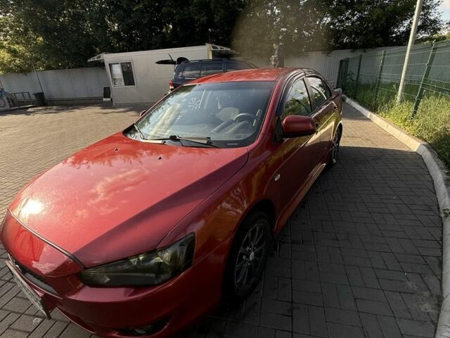 Красный Мицубиси Лансер, объемом двигателя 2 л и пробегом 215 тыс. км за 5999 $, фото 3 на Automoto.ua