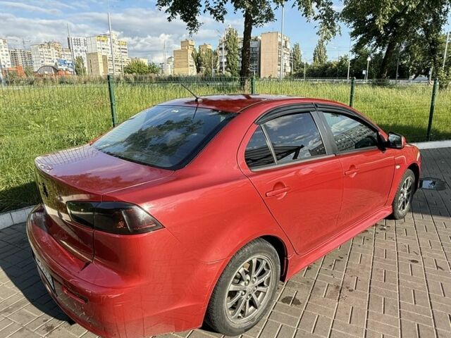 Красный Мицубиси Лансер, объемом двигателя 2 л и пробегом 215 тыс. км за 5999 $, фото 7 на Automoto.ua