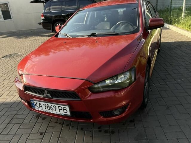 Красный Мицубиси Лансер, объемом двигателя 2 л и пробегом 215 тыс. км за 5999 $, фото 2 на Automoto.ua