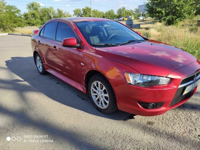 Червоний Міцубісі Lancer, об'ємом двигуна 2 л та пробігом 146 тис. км за 9000 $, фото 1 на Automoto.ua