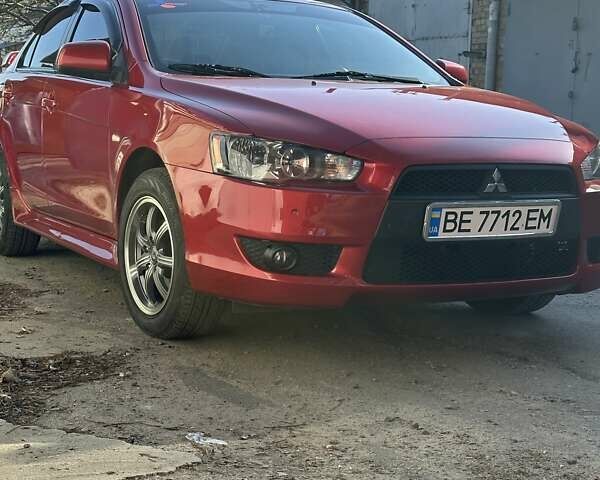 Червоний Міцубісі Lancer, об'ємом двигуна 2 л та пробігом 111 тис. км за 9700 $, фото 4 на Automoto.ua