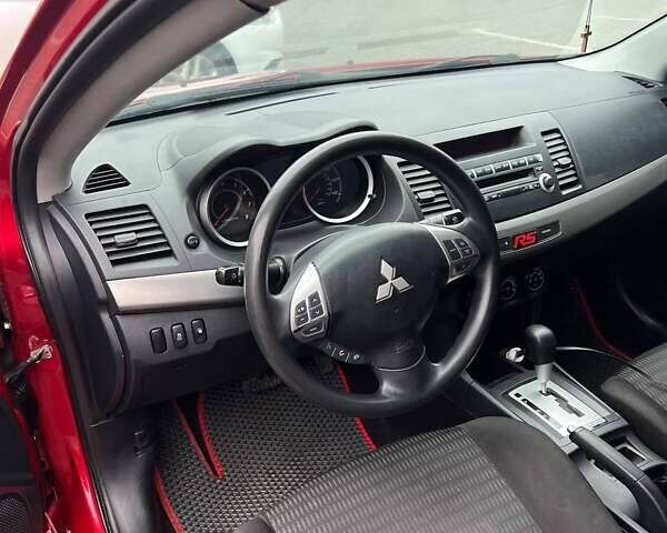 Красный Мицубиси Лансер, объемом двигателя 2 л и пробегом 230 тыс. км за 6700 $, фото 8 на Automoto.ua