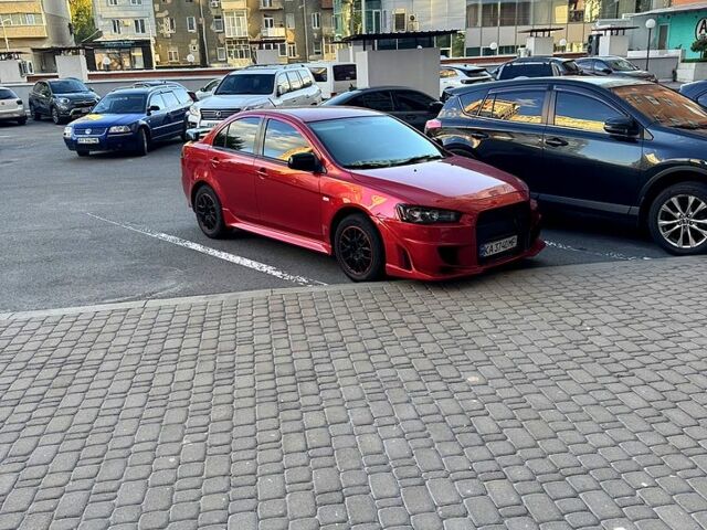 Мицубиси Лансер 2012 в Харькове на Automoto.ua Красный Мицубиси Лансер, объемом двигателя 2 л и пробегом 260 тыс. км за 6900 $, фото 6 на Automoto.ua