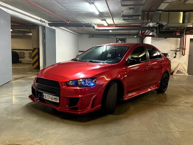 Мицубиси Лансер 2012 в Харькове на Automoto.ua Красный Мицубиси Лансер, объемом двигателя 2 л и пробегом 260 тыс. км за 6900 $, фото 5 на Automoto.ua