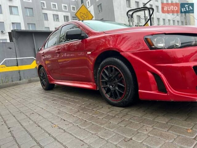 Красный Мицубиси Лансер, объемом двигателя 2 л и пробегом 230 тыс. км за 6700 $, фото 1 на Automoto.ua