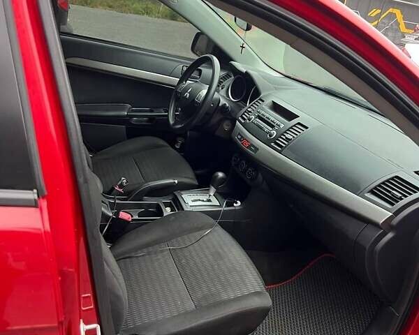 Красный Мицубиси Лансер, объемом двигателя 2 л и пробегом 230 тыс. км за 6700 $, фото 7 на Automoto.ua