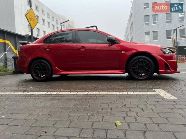 Красный Мицубиси Лансер, объемом двигателя 2 л и пробегом 230 тыс. км за 6700 $, фото 4 на Automoto.ua