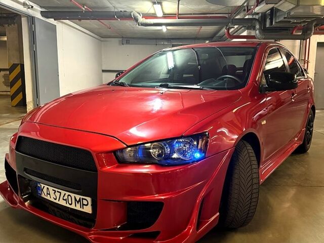 Красный Мицубиси Лансер, объемом двигателя 2 л и пробегом 260 тыс. км за 7300 $, фото 1 на Automoto.ua